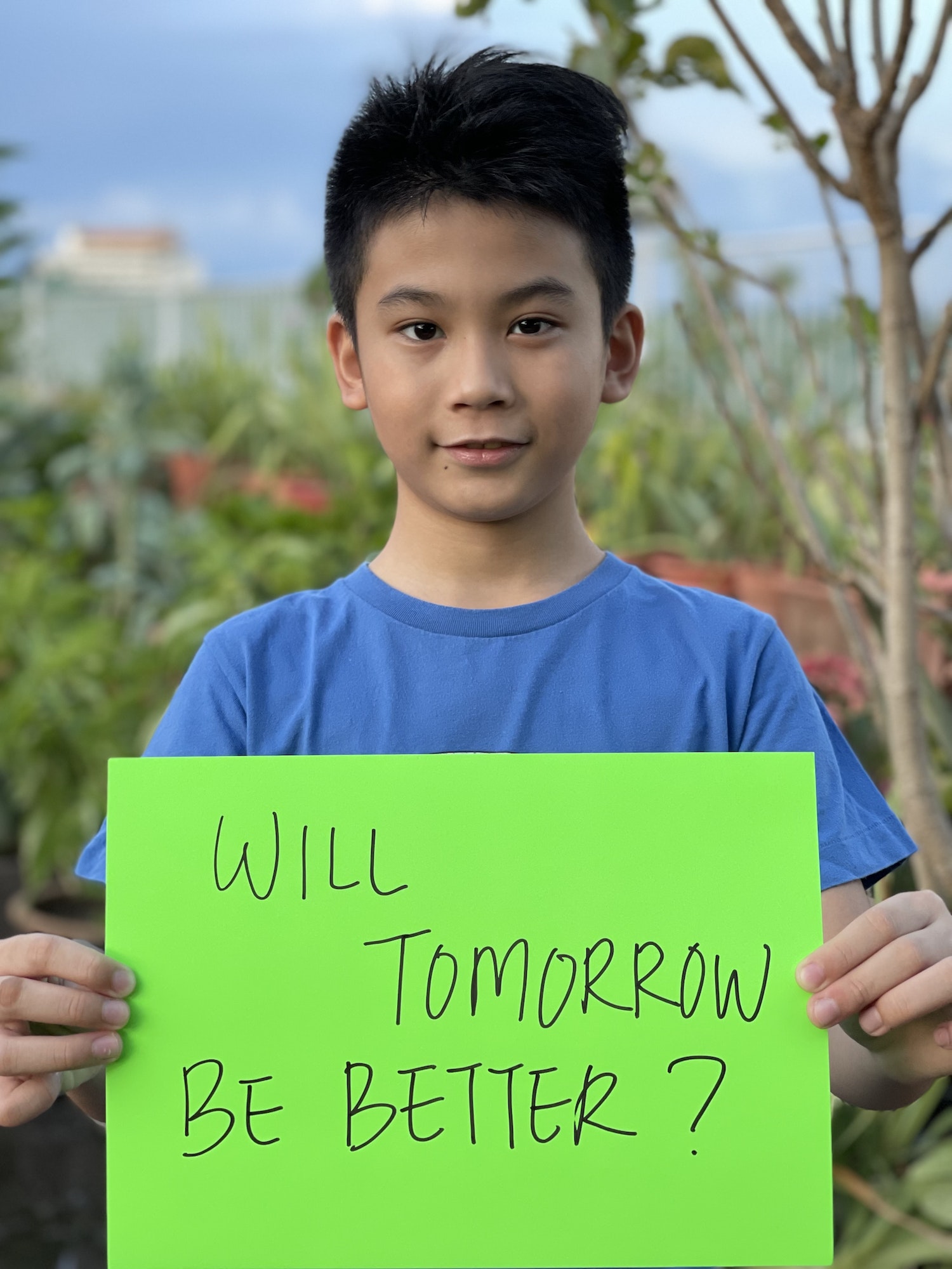 Gen z holding a card asking will tomorrow be better?