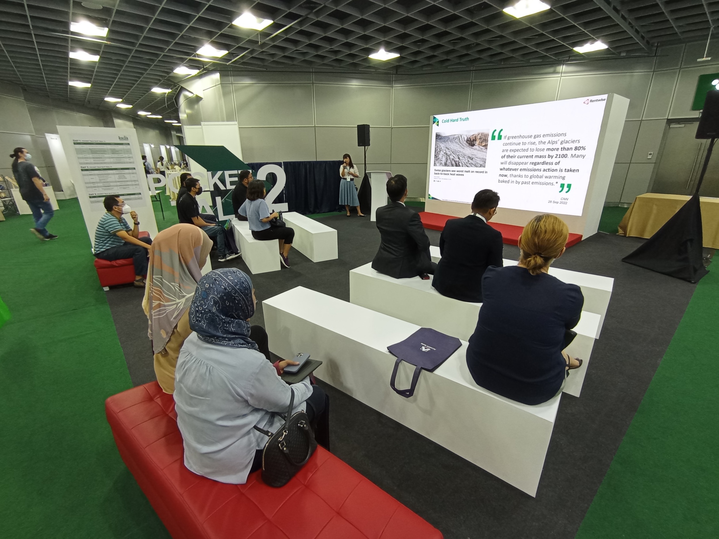 Leanne engaging the crowd at IGEM 2022 during a pocket talk session to share about Rentwise’s circular IT solution