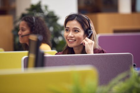 mature-businesswoman-wearing-phone-headset-talking-2021-12-09-06-51-03-utc-scaled.jpg